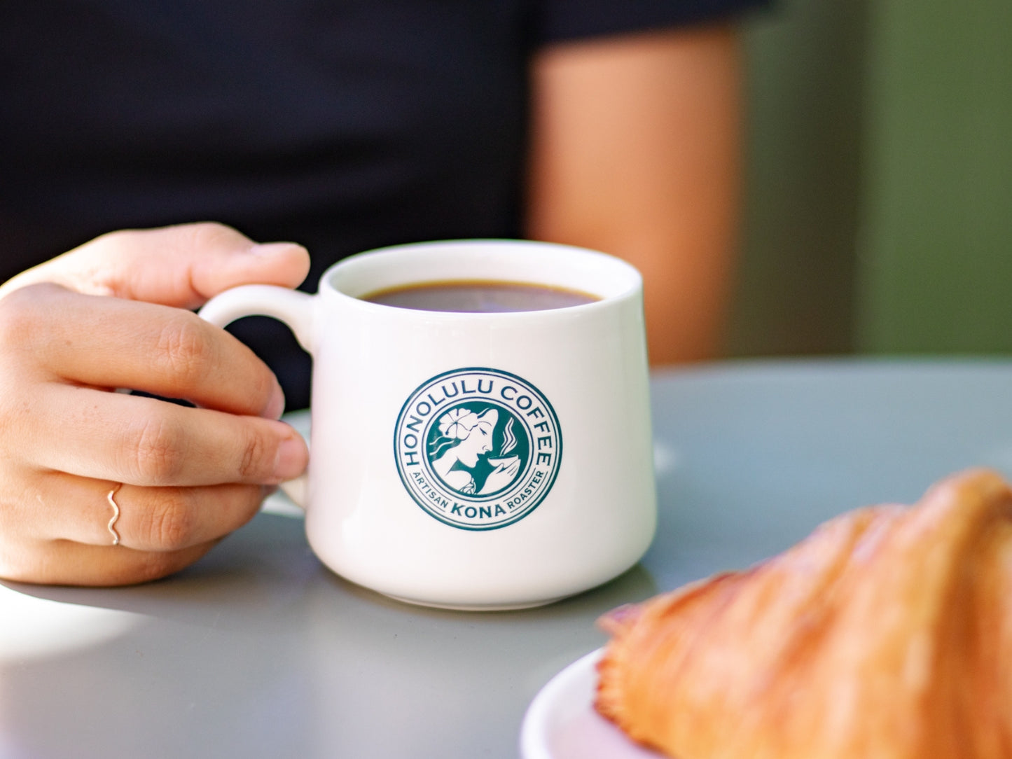 Honolulu Coffee Co. logo on crescent mug