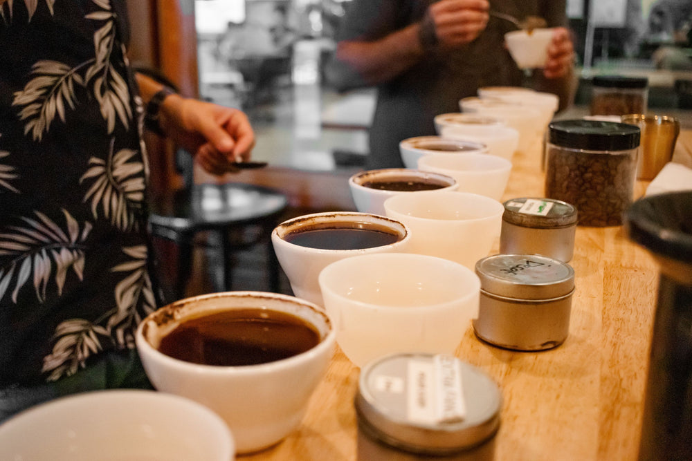 Coffee cupping bowls lined up on a table