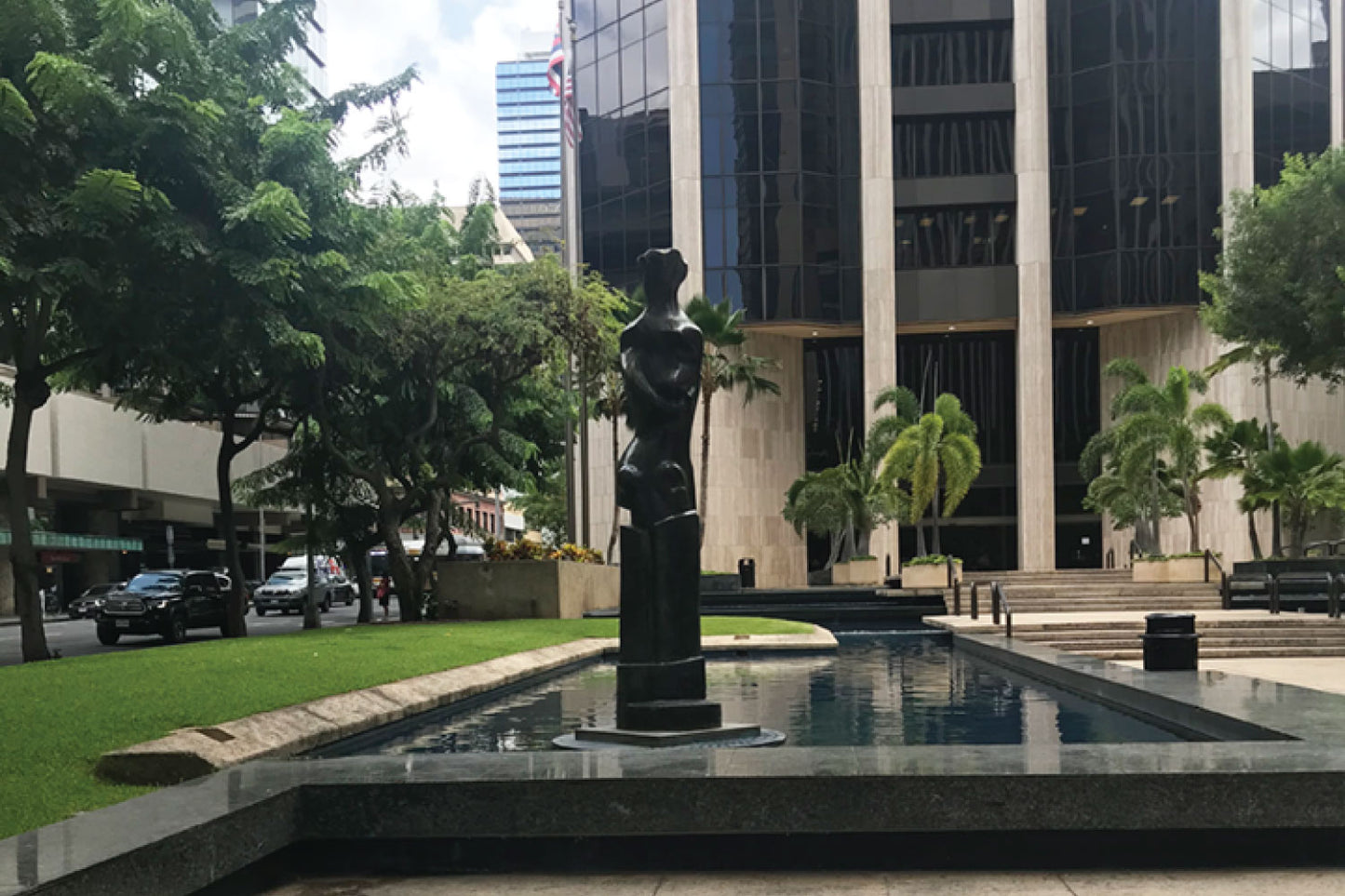 Statue in Hawaii near a pool of water