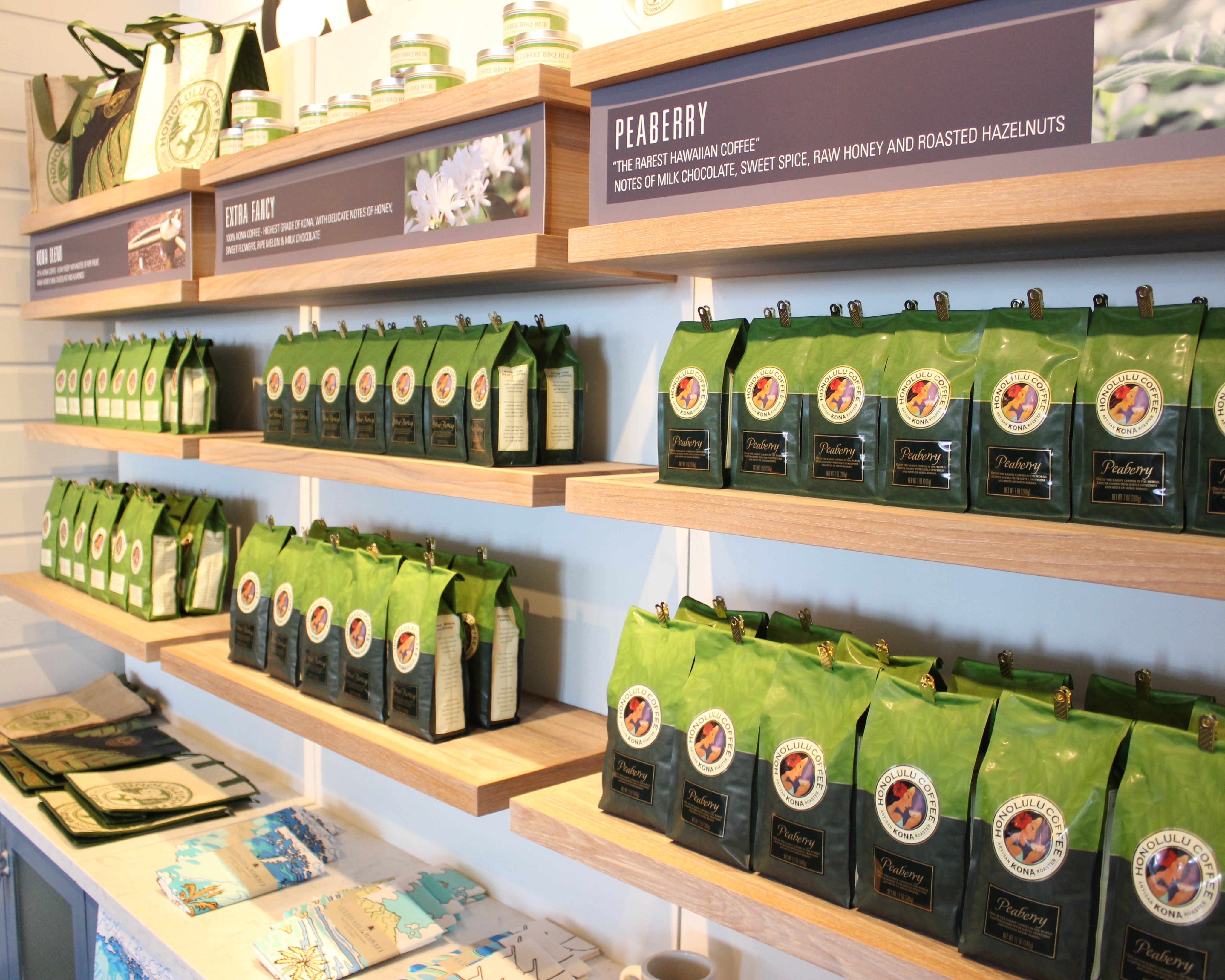 Lines of our Kona coffee on the retail shelf of our Prince Waikiki location.