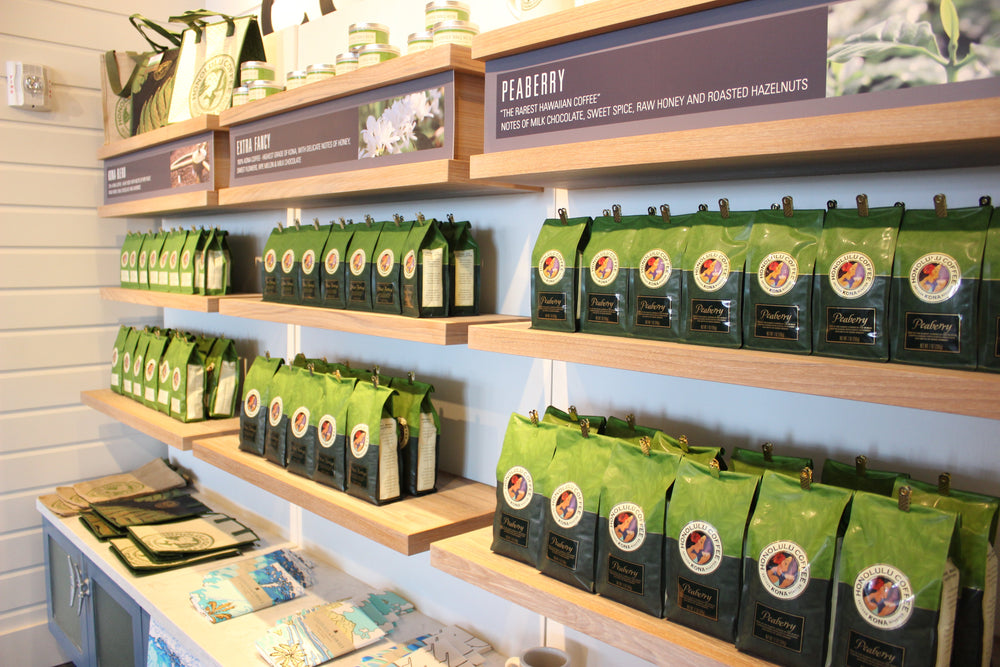 Lines of our Kona coffee on the retail shelf of our Prince Waikiki location.