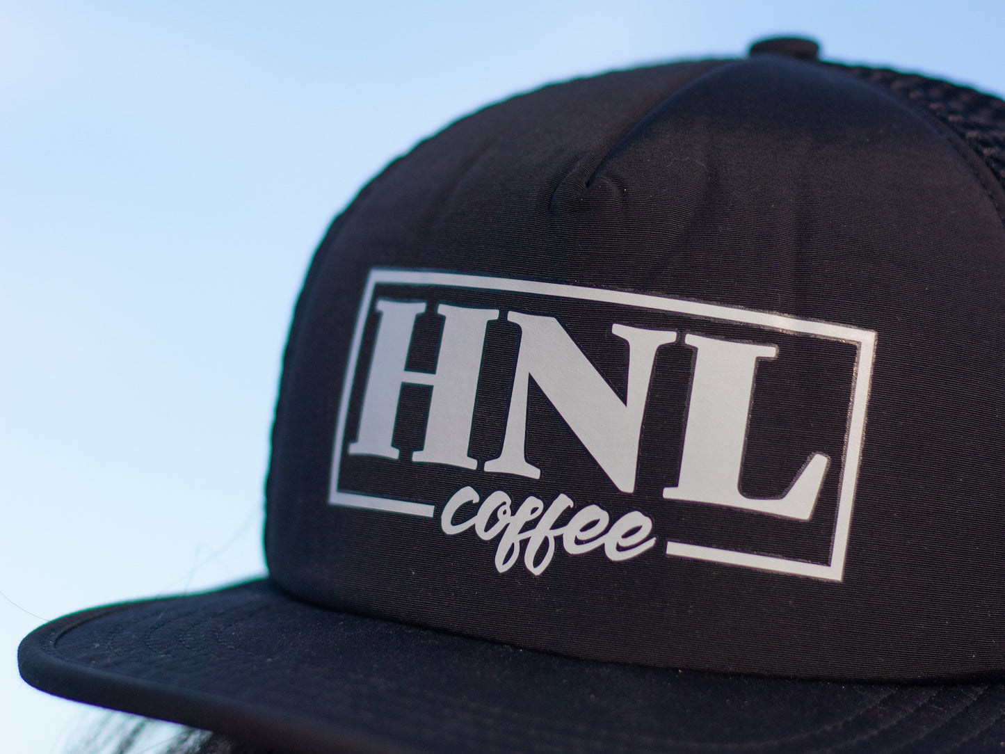 
                  
                    Black HNL Trucker Cap
                  
                