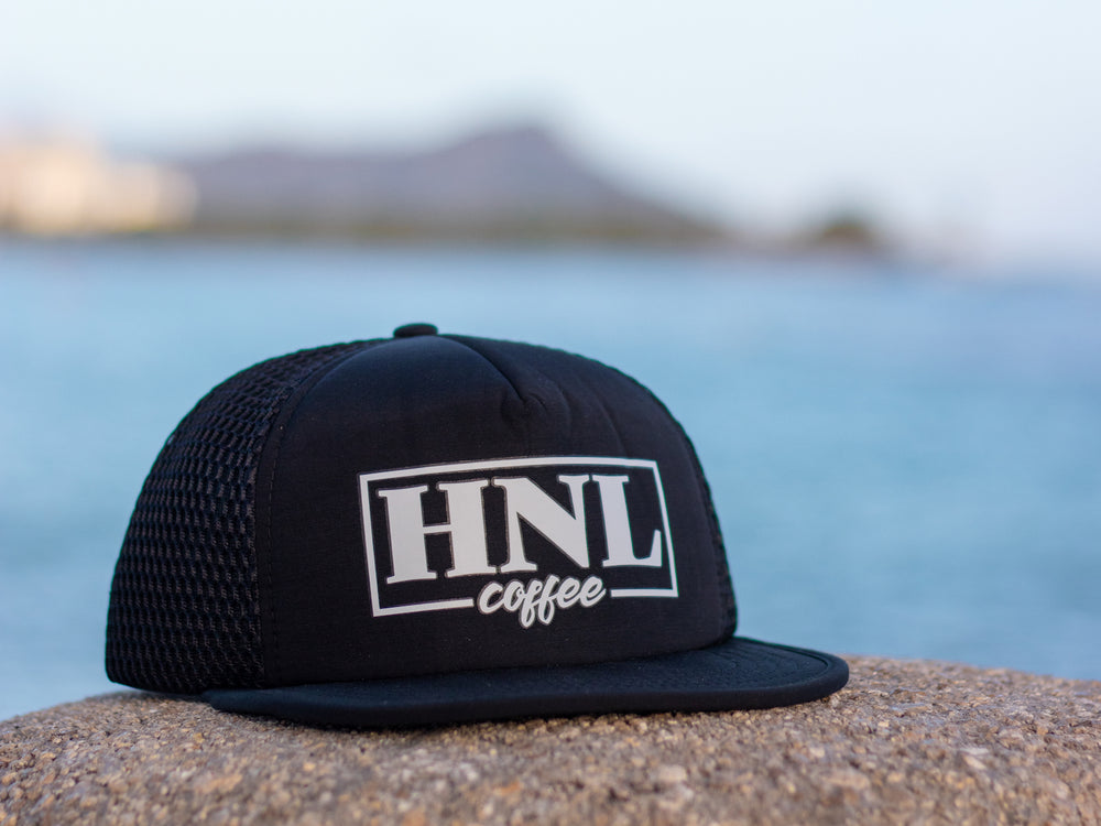 
                  
                    Black HNL Trucker Cap
                  
                