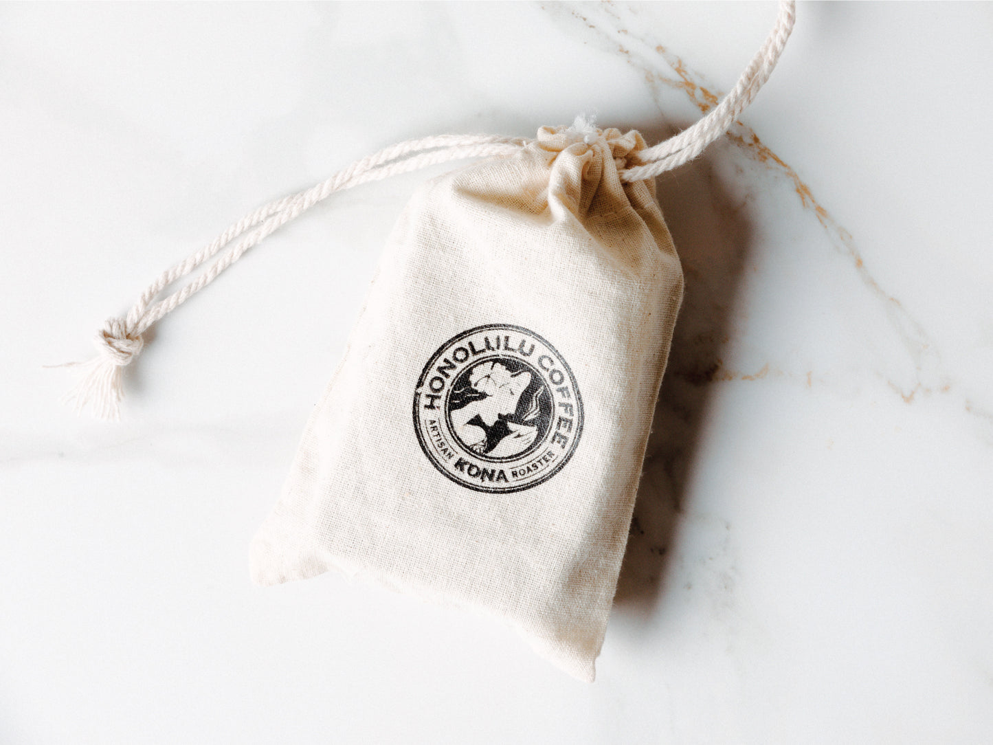 
                  
                    Kope soap in a branded bag on granite, this side includes the Honolulu Coffee logo
                  
                