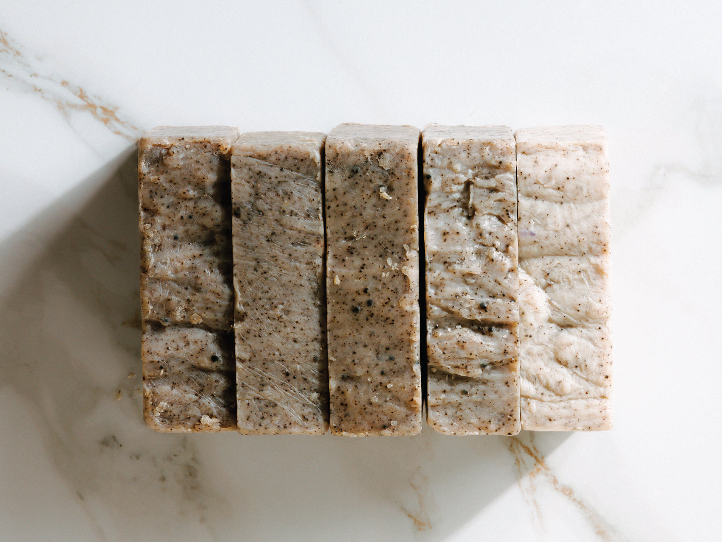 
                  
                    5 bars of Kope Soap next to each other on granite
                  
                